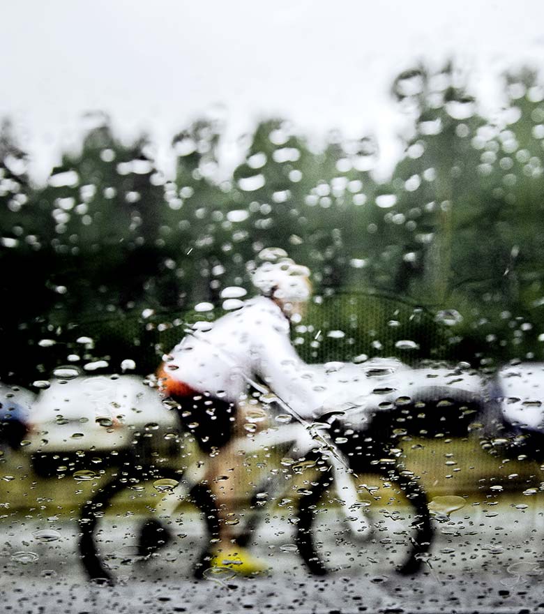 Electric bike rider on a rainy day| Featured image for Is It Safe to Ride an Electric Bike in the Rain?